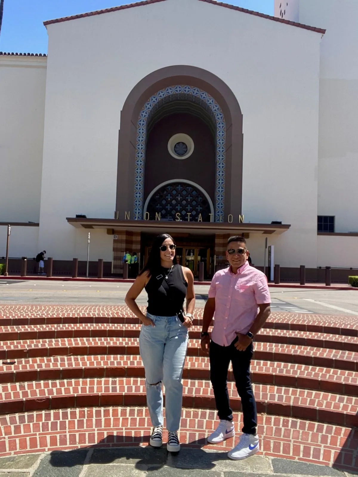 Katherine and Isaac standing on the steps in front of Union Station